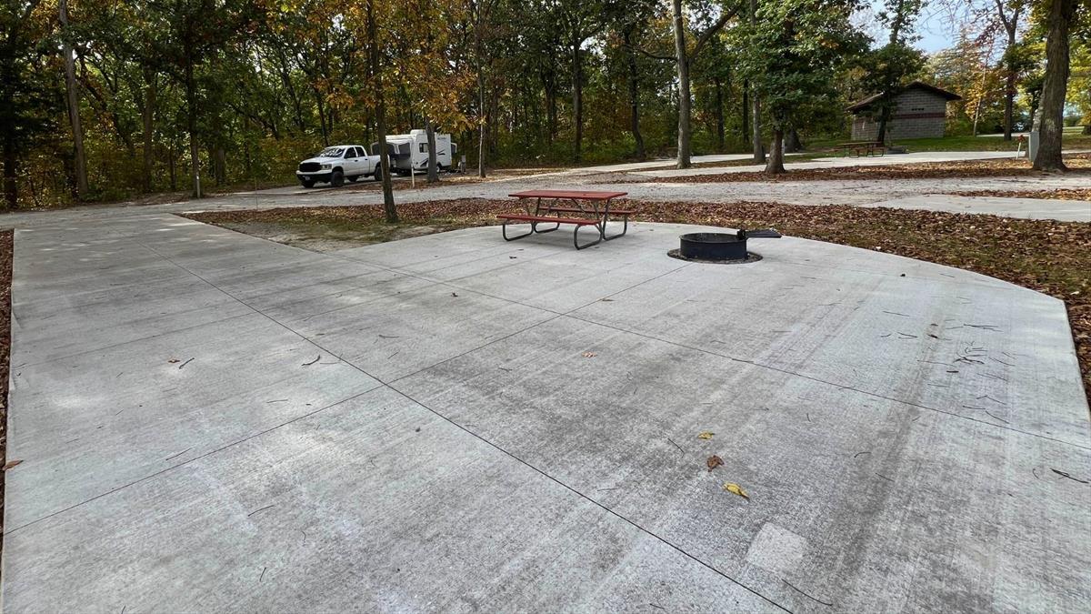 Concrete campsite with fire ring and picnic table