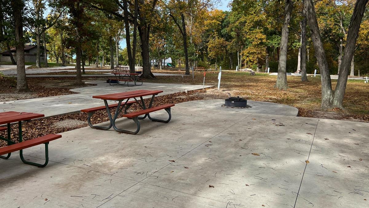 Concrete campsite with fire ring and picnic table