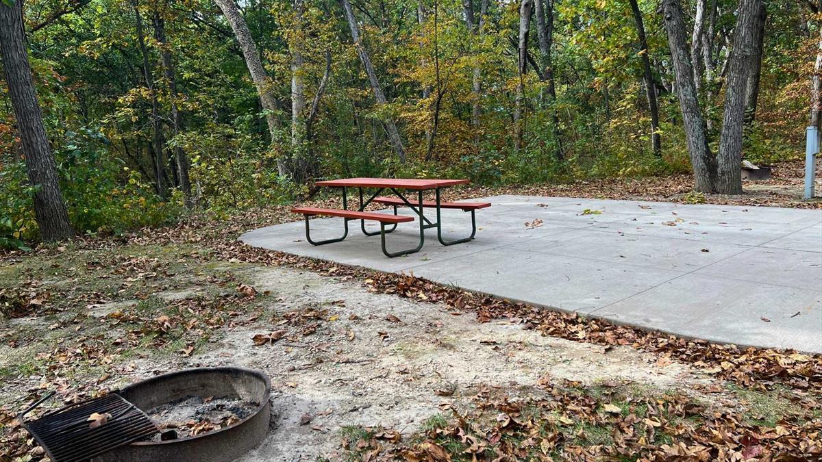 Concrete campsite with fire ring and picnic table