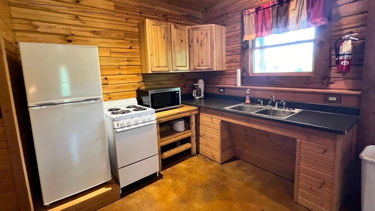 Cabin kitchen with oven microwave and fridge