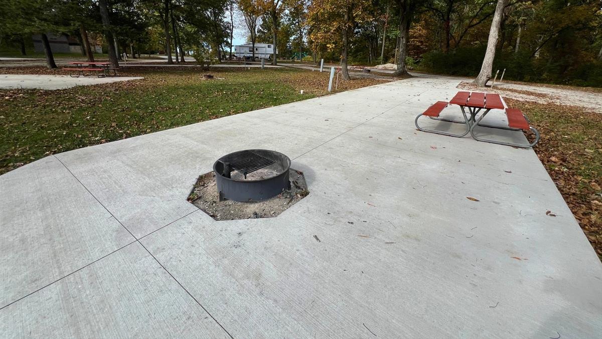 Concrete campsite with fire ring and picnic table