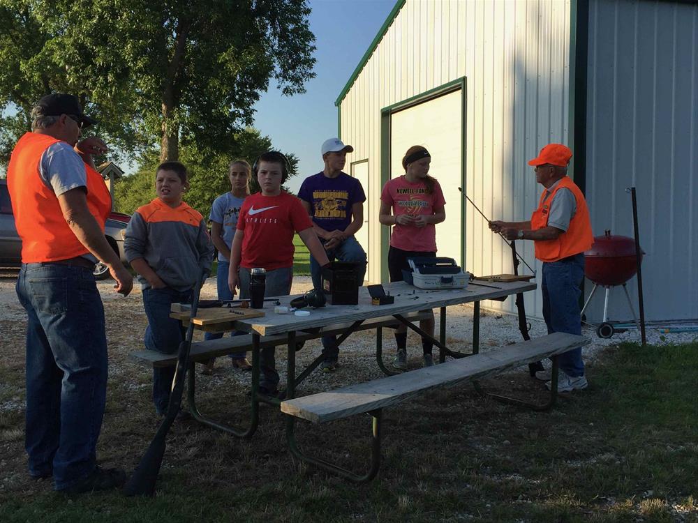 Hunter Safety Instructors Teaching Kids About Muzzleloaders