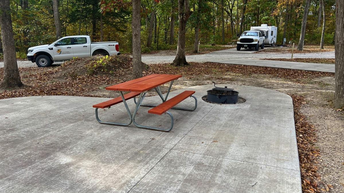 Concrete campsite with fire ring and picnic table