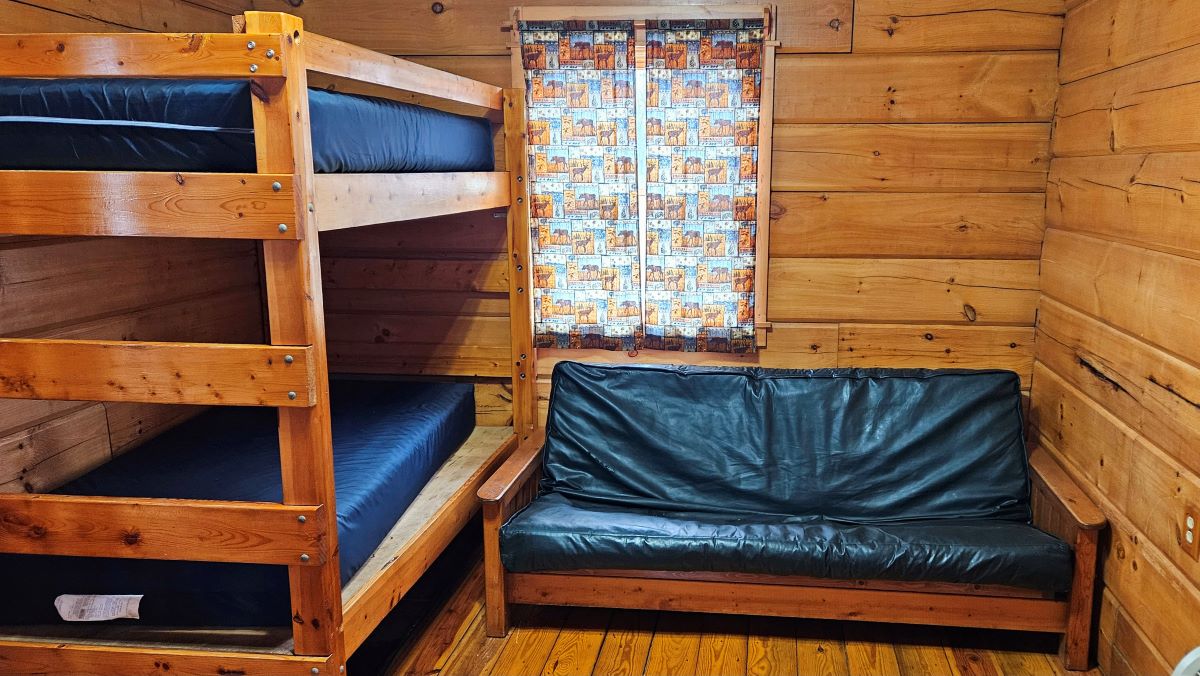 Cabin 2 inside with bunk bed and full-size futon