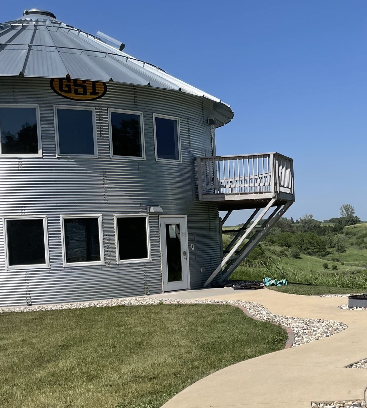 Grain Bin Cabin exterior view of windows with upper level deck