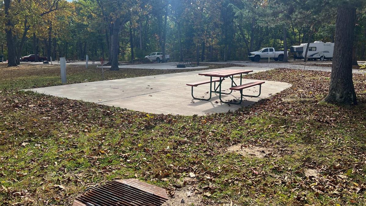 Concrete campsite with fire ring and picnic table