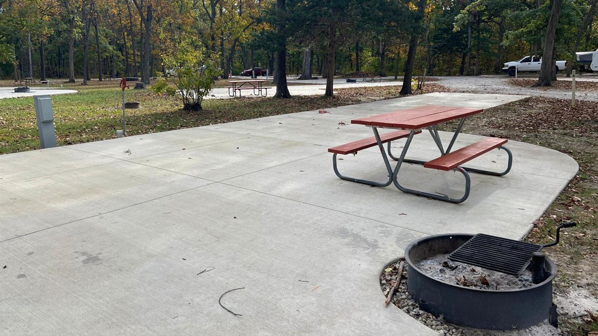 Concrete campsite with fire ring and picnic table