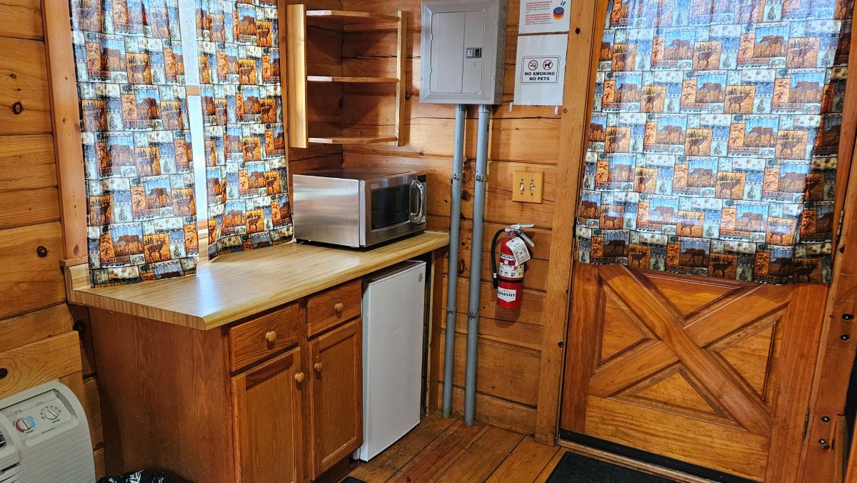 Cabin 1 kitchen area with microwave and mini-fridge