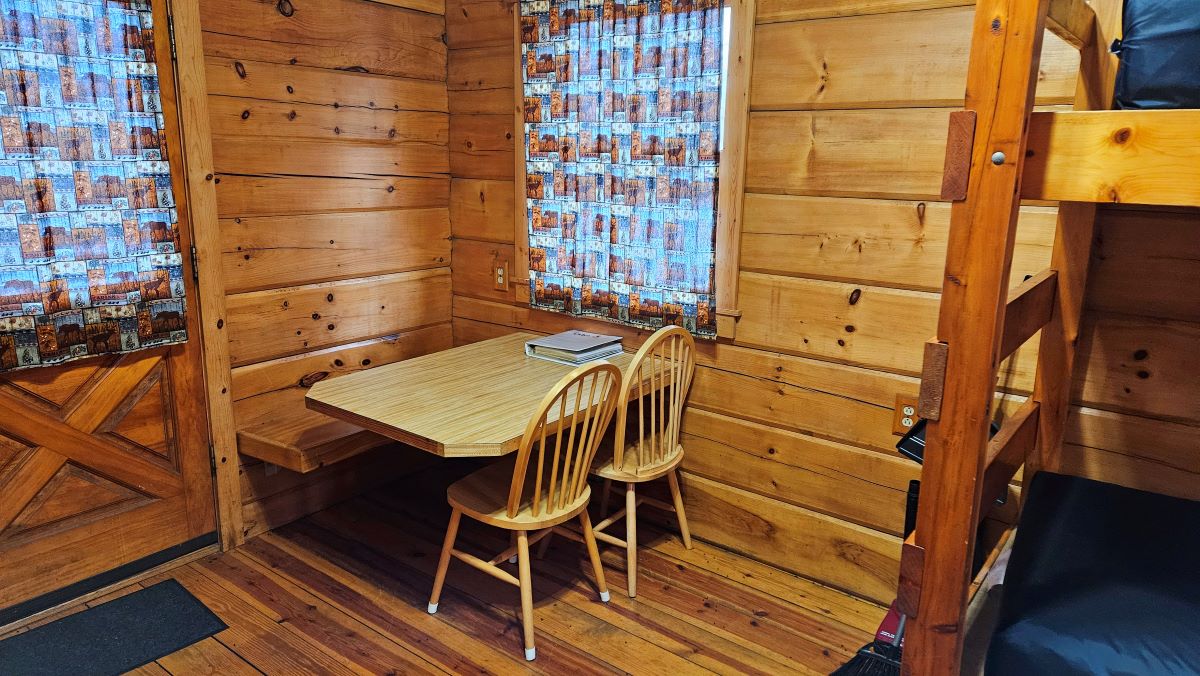 Cabin 3 table and chairs with door to the deck