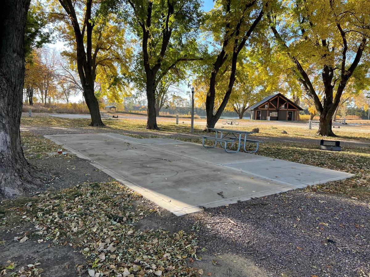 Douma campsite #2 cement parking pad with picnic table and fire pit