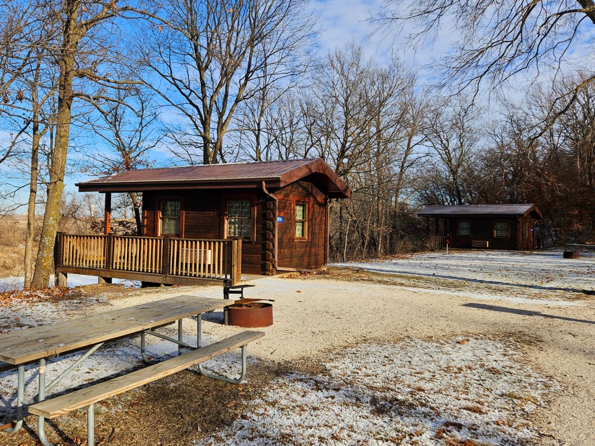 Cabin 2 with picnic table, fire ring and Cabin 1 to the right