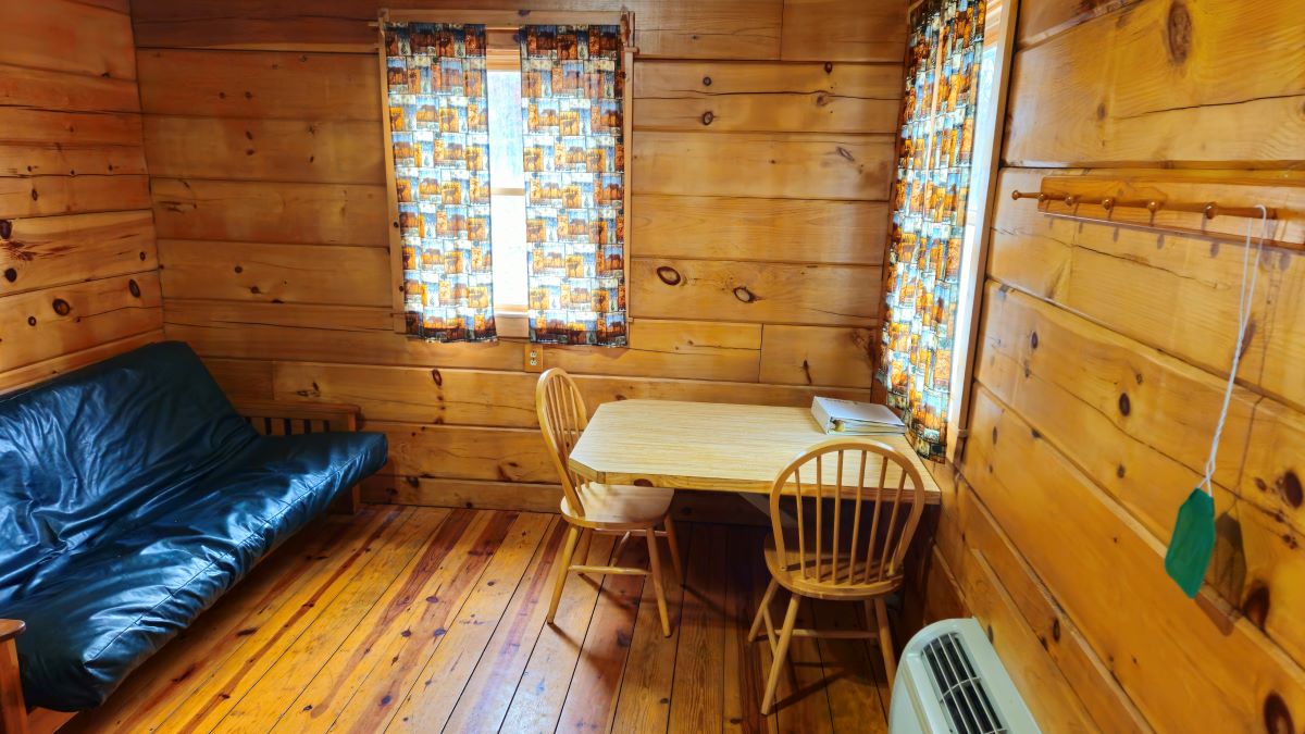 Cabin 1 with table and chairs and full size futon