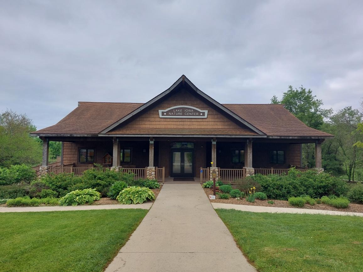 Lake Iowa Nature Center - Outside spring view of nature center from the front of building