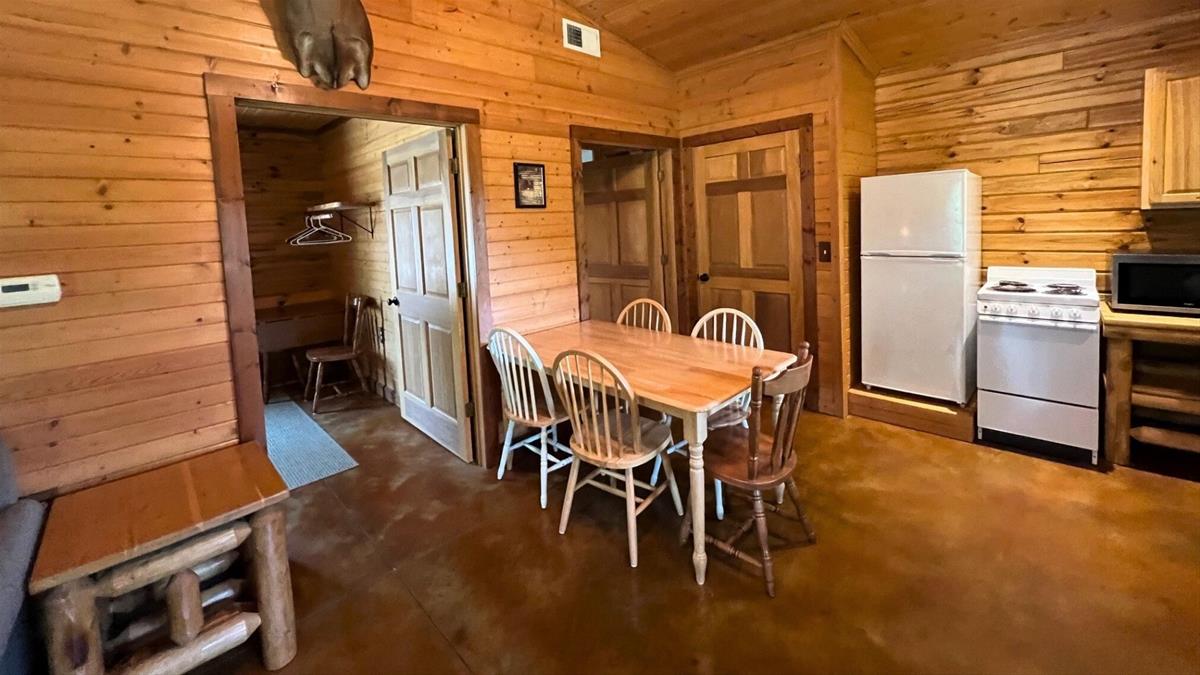 Cabin dining area with table and chairs